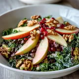 Tossed with a zesty apple cider dressing, this healthy Kale and Pomegranate Bowl offers a perfect mix of sweet, tart, and earthy flavors.