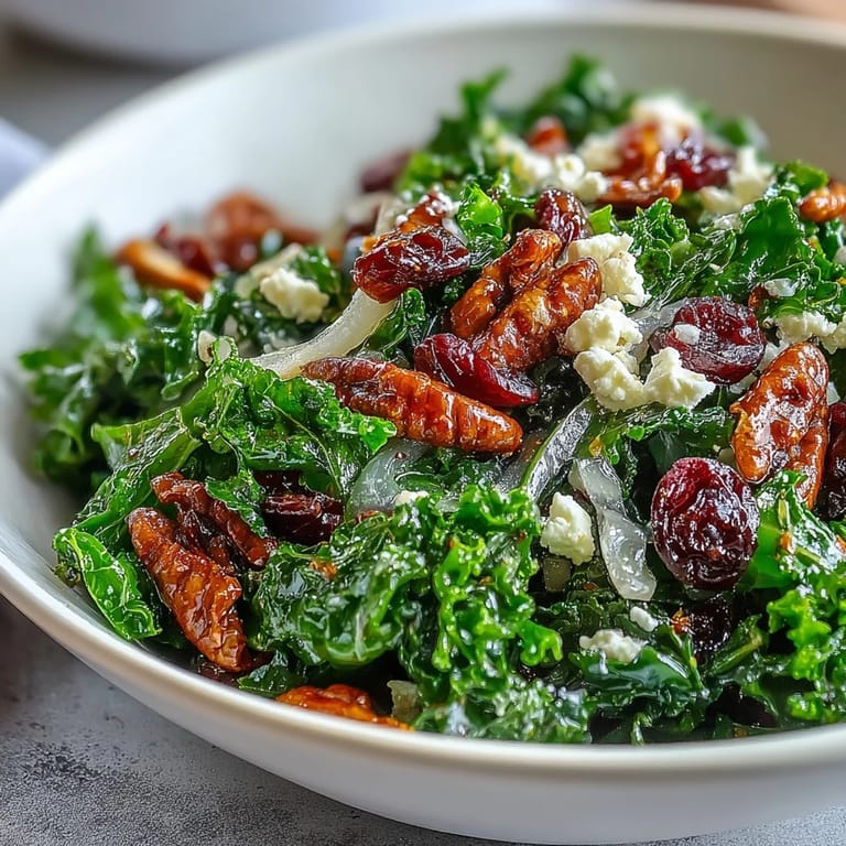 A vibrant bowl of Warm Kale Salad with Maple Mustard Dressing, ready to serve.