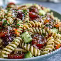 Colorful Memorial Day pasta salad with fresh veggies and Italian dressing.